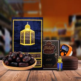 A Ramadan essentials pack featuring a prayer mat, digital counter, pocket Quran, perfume, khattab kofi, and Mazafati dates.