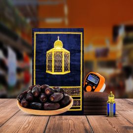 A complete Ramadan essentials pack including a prayer mat, digital counter, perfume, khattab kofi, and Mazafati dates.